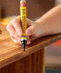 Hand using Wood Finish Stain Marker For Easy No Fuss Touch Ups Provincial Shade Nicks And Scratches On Wood Furniture And Crafts