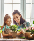 Mother and daughter gardening with Biodegradable Seedling Pots 120 Pack 3.15 Inch With 30 Plant Labels for germination in sunlight