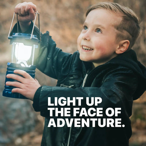 Child holding blue camping lantern, part of 4 Pack Multicolor Camping Lanterns, Ultra Bright LED Tent Lights for Power Outages.