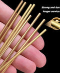Top Shelf Solid Brass Round Rod 15Mm Diameter By Point Three Meter Length Two Pack Pure Copper Alloy Stock For Diy Metalworking and Electrical Fabrication Hacksaw Friendly Shop Floor Bar held in hand.