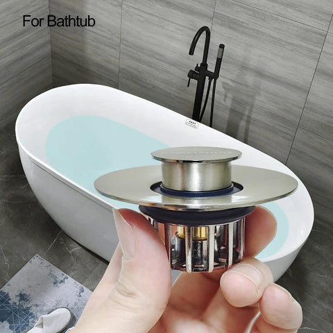 Tough As Nails Pop Up Tub Stopper With Integrated Hair Catcher And Fine Mesh Strainer in hand, showing stainless steel design.