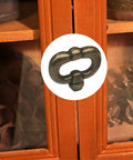 Two Pack Vintage Style Drawer Knob Ring In Antique Bronze mounted on wooden cabinet