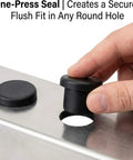Inserting T type stopper from 150 Piece Solid Silicone Hole Plugs Set For Powder Coating And Lab Use into round hole on metal surface