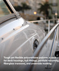 Adhesive Sealant 5200 Fast Cure for Boats & RVs on boat hull with stainless steel railing, ideal for marine sealing.