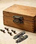 Heavy Duty Metal Jewelry Box Latch Clasp With Retro Floral Duckbilled Toggle Hasps Perfect For Wooden Cabinet Furniture Repair Restoration And Upgrades That Stick Tight And Look Super Cool. Antique iron jewelry box latch on wooden chest, with screws