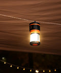 Beast Bright Rechargeable LED Camping Lantern 1800 Lumens hanging under tent canopy at night