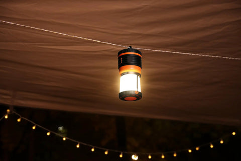 Beast Bright Rechargeable LED Camping Lantern 1800 Lumens hanging under tent canopy at night