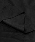 Close-up of black suede headliner fabric, double-sided with foam-free backing for auto interiors