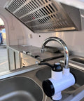 Ready To Roll Custom Mobile Food Truck Trailer With Commercial Kitchen stainless steel sink and faucet for food prep.