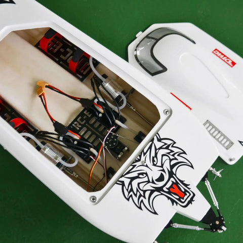 Open interior view of High Performance Fiber Glass RC Boat With Water Cooling Dual Electric Motors Servos And ESCs PNP Without Battery CNC Metal Rudder Fast 65 To 70 KMH Hobby Boat, featuring wiring and tiger design.