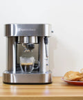 Top Tier Stainless Steel Espresso Machine With Reliable 19 Bar Italian Pump And Quick Ground Or ESE Pod Brewing Featuring Precise Temp Control and Zero Frustration Pre Brew For Killer Daily Coffee Routines on wooden countertop.