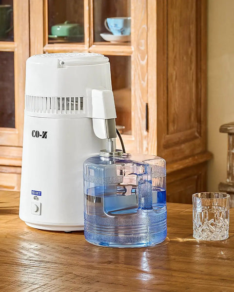 Zero Sweat 1.1 Gallon Water Distiller Smooth Countertop Pure Water Maker Featuring 750W fast processing on wooden table.
