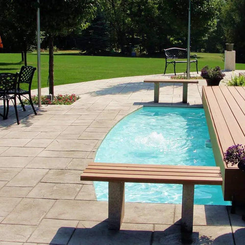 Sky Blue Non-Toxic Pond Shield Epoxy Paint in decorative backyard water feature beside a patio with trees and seating.