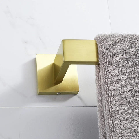 Four Piece Brushed Gold Stainless Steel Bathroom Hardware Set Including Towel Bars Toilet Paper Holder And Cloth Hook Made With SUS304 Rust Resistant Finish For Durable Modern Sleek Bathroom Organization And A Cool Vibe showing gold towel bar with towel