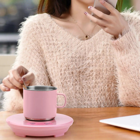 Electric Desk Cup Warmer And Cooler For Coffee Mugs Cans Bottles Precise Hot Cold Temp Control Keep Your Daily Brew Cozy Or Truly Ice Chill Home Office Game Changer Easy Wipe Surface with pink cup and warmer on wooden desk.