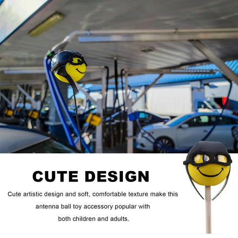 Funny Pilot Antenna Topper Ball For Cars EVA Foam Exterior Decoration in a car wash setting on a vehicle antenna.