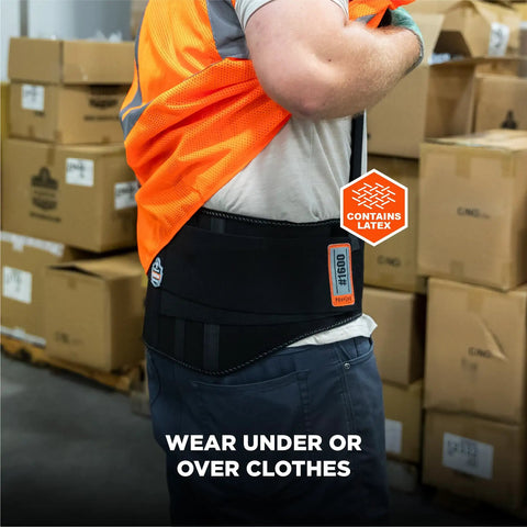 Person wearing ProFlex 1600 Back Support Brace with 9 Inch Extended Support under safety vest in warehouse environment.