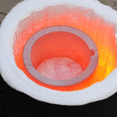 Inside view of Heavy Duty Graphite Crucible With Smooth Pouring Spout For Melting Aluminum Up To 1800 C, show glowing interior.