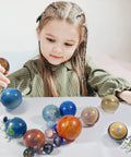 Child playing with Solar System Planets STEM Toys For Kids Kid Friendly Non Toxic Sensory Space Set With 10 Planets Moon And Sun