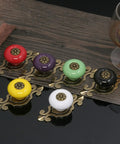 Top Shelf Vintage Ceramic Cabinet Knobs And Dresser Pulls Featuring Heavy Duty Zinc Alloy Backplates Breezy Hardware Swap For Kitchen Cupboards And Vanity Refresh 10 Pack with various colorful ceramic knobs on display.