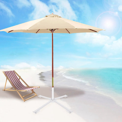 Adjustable Portable Foldable Beach Anchor Base For Outdoor Sunshade Stand And Patio Umbrella on sand with ocean background.