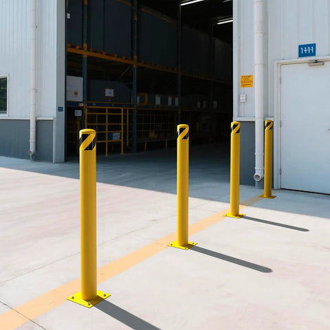 Rock Solid 2 Pack Carbon Steel Security Bollards, Heavy Duty 42 Inch Parking Barrier Posts with yellow powder coating in a warehouse.