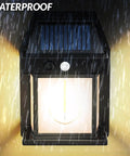 Heavy Duty Solar Wall Lights Outdoor Two Pack Weatherproof Security Sconces in rain with solar panel and glowing light.