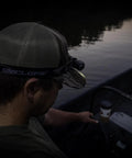 Person wearing Hades Headlamp Go-To 1000 Lumen Rechargeable LED Weather Ready IPX4 in dark on a boat