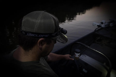 Person wearing Hades Headlamp Go-To 1000 Lumen Rechargeable LED Weather Ready IPX4 in dark on a boat