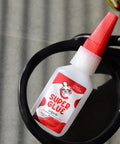 Heavy Duty Quick Dry All Purpose Glue 20G Tough As Nails For Plastic Metal Wood Leather Rubber Glass Clear Bond For Home Repairs DIY Crafts Toys And Furniture Fixes displayed in a small white bottle with a red cap