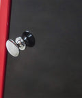 Close-up of handle on red and black Rolling Garage Workshop Tool Organizer With Detachable Four-Drawer Chest Large Storage Cabinet.
