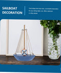 Mediterranean Wooden Sailboat Model Decor for Home and Office Cozy Cottage Nautical Vibe Ornament beside framed photo