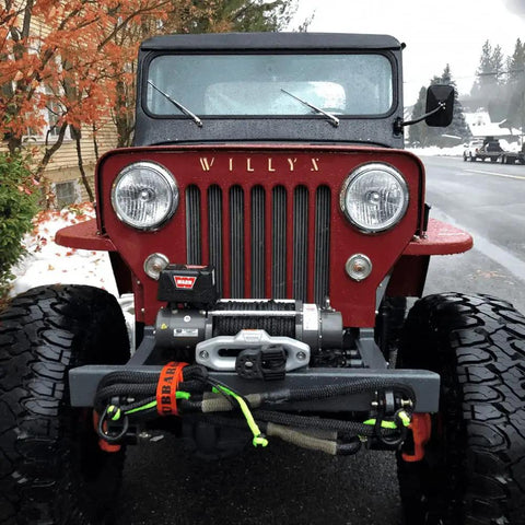 Front view of a red Jeep with Heavy Duty Three Eighth Inch Synthetic Shackle NexGen PRO Gator Jaw in red and black attached