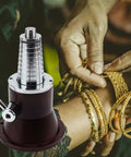 Precision Bangle Stretcher And Ring Sizer Mandrel for expanding tight bands, shown in use with hands and gold bangles.