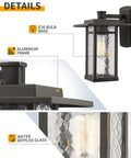 Close-up details of Dusk To Dawn Outdoor Wall Light Fixture with aluminum frame and water rippled glass, Craftsman style.