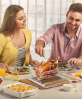 People enjoying a meal with turkey on Adjustable Chicken and Turkey Roasting Rack With Foldable Stainless Steel V Shaped Stand