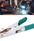 Hot Welding Ground Clamp With Massive Copper Alloy Body For 300 Amps, close-up of copper clamp with green handles.