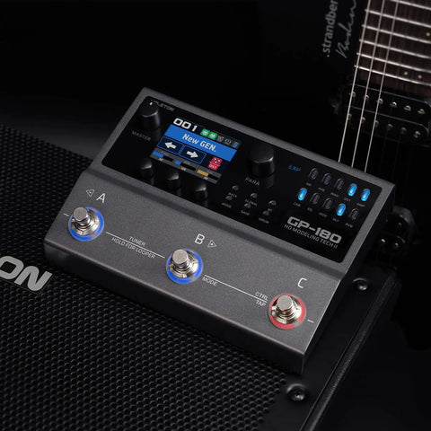 GP-180 Multi-Effects Guitar Processor with HD Modeling on amp with guitar, showing knobs and control panel