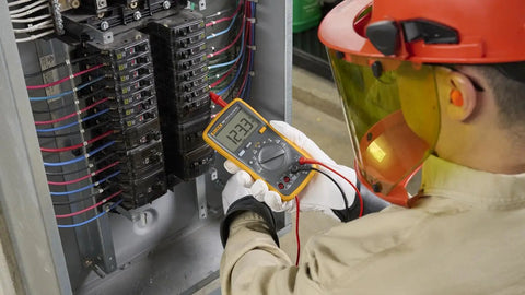 Technician using Digital Multimeter For Electrical Projects With AC And DC Voltage And Current Measurement Up To 1000V And 10A Plus