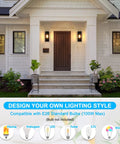 Top Shelf Matte Black Outdoor Wall Lights illuminating a front porch, compatible with E26 bulbs, stylish and weather resistant.