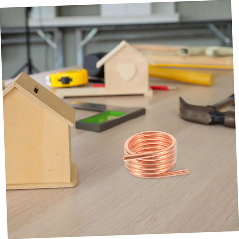 550 540 Brushed RC Boat Water Cooling Ring Kit with copper tube on wooden table in workshop setting