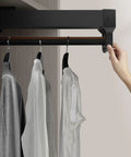 No Brainer Retractable Ceiling Mounted Clothes Rail For Closet Space Saving Wardrobe Organizer in use with shirts hanging