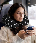 Woman using Polka Dot U Shaped Travel Pillow With Memory Foam Core For Naps On Planes Cars And At Home Or In The Office