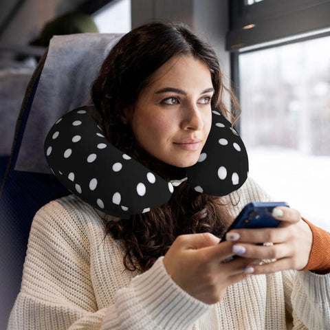 Woman using Polka Dot U Shaped Travel Pillow With Memory Foam Core For Naps On Planes Cars And At Home Or In The Office