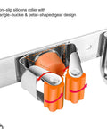 Close-up of Orange Stainless Steel Broom Mop Holder Wall Mount Organizer with non-slip silicone roller and gear design