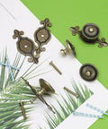 8 Piece Vintage Cabinet Knobs Set In Solid Antique Brass With Backplates Mushroom Pull Handles displayed with screws