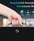Hand holding Boss-Grade Portable Safe Box With Key Lock For Fire Resistant Document Storage At Home In The Car Or Outdoors.