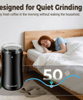 One Touch Electric Coffee Grinder for Beans, Spices, Herbs and Seeds, compact black kitchen mill next to a sleeping person