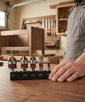 Man holding Premium Countersink Drill Bit Set With 82 Degree, Five Flutes, Quick Change Hex Shank on workshop table