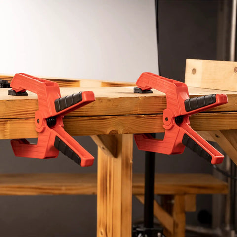 9 Inch Heavy Duty Spring Clamps With Kickass Grip Rock Solid Build Hella Durable Engineering Plastic And Soft Bi Material Handles Sweet For Woodworking And Quick Shop Fixes 2 Piece Set on wooden table.